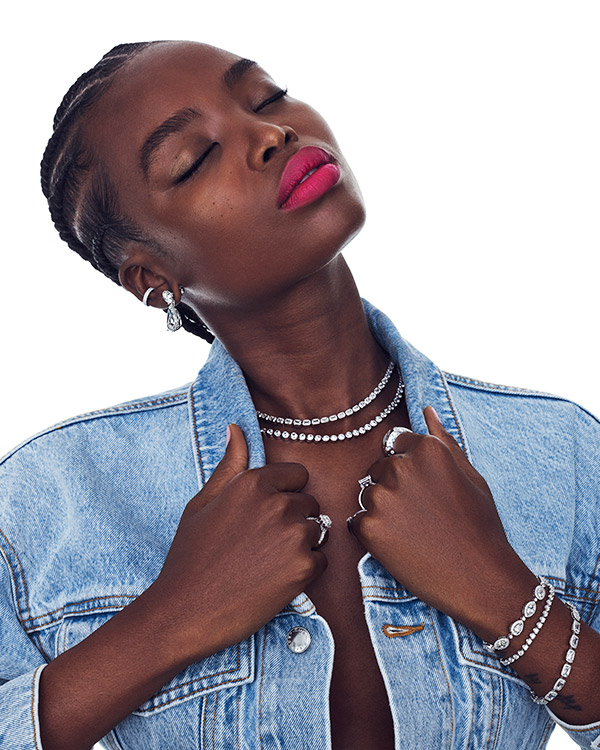 Model in denim with diamond tennis bracelets