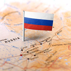 Russian flag planted on a map of Russia
