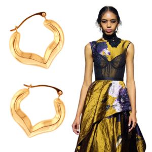 Erdem fall 2023 model and Royal Chain half heart hoop earrings
