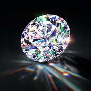 Ideal-cut diamond sparkling against a black background