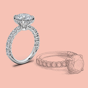 The sketch of an engagement ring with halo and pave diamonds next to the actual ring.